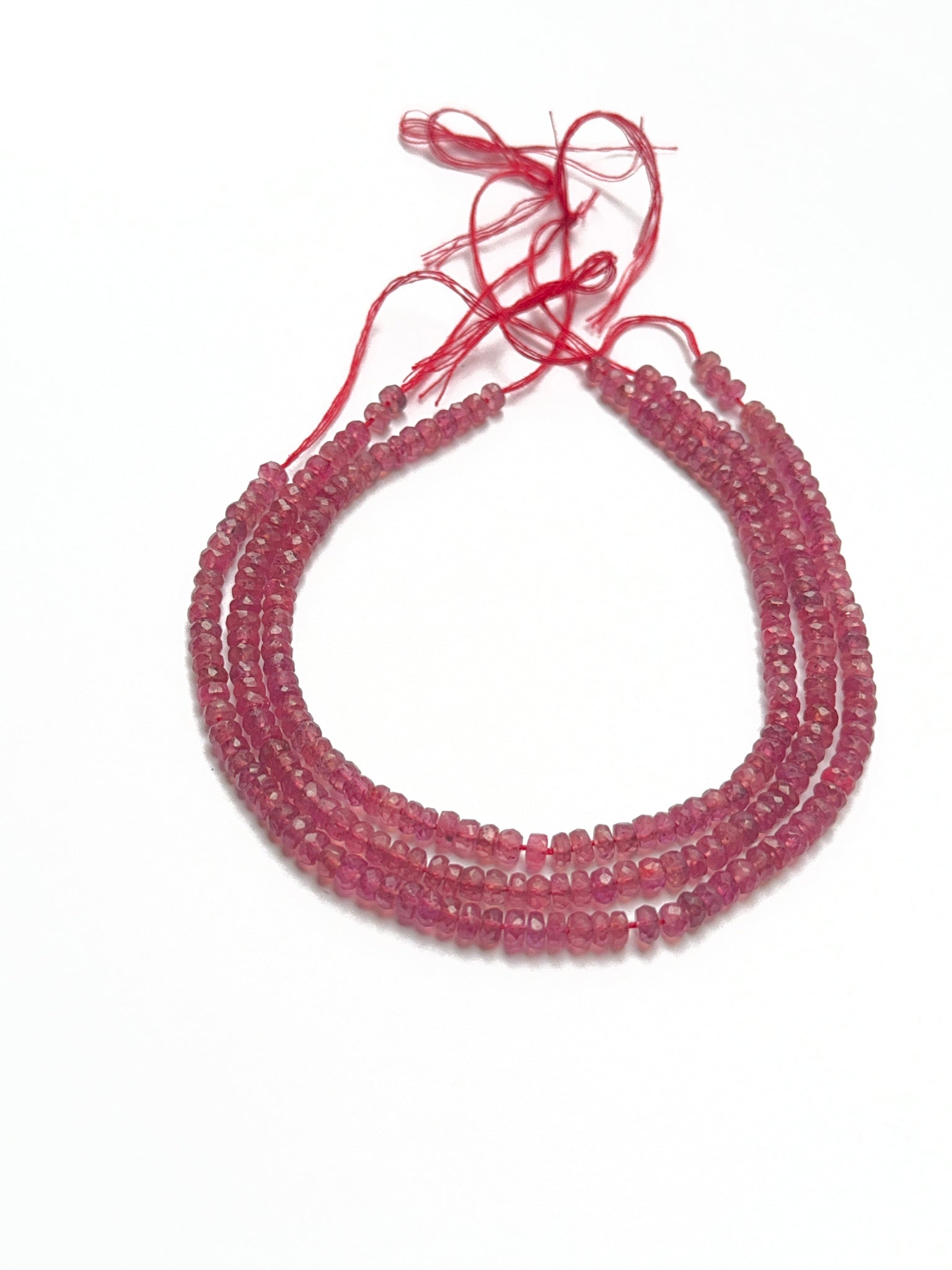Bright ruby stone beads in faceted rondelle shape, showcasing shine and quality for handmade jewellery components.