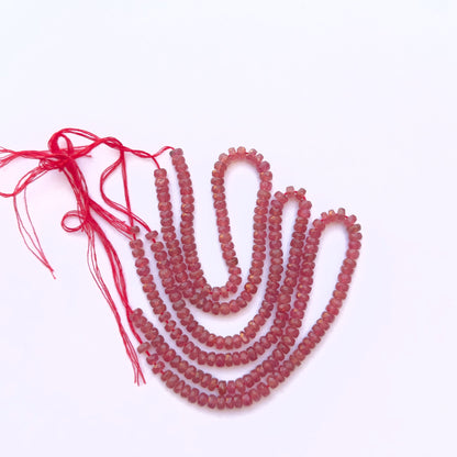Ruby faceted rondelle beads with 4.2–4.5mm sizing, offering vibrant colour and shine for creative jewellery making.