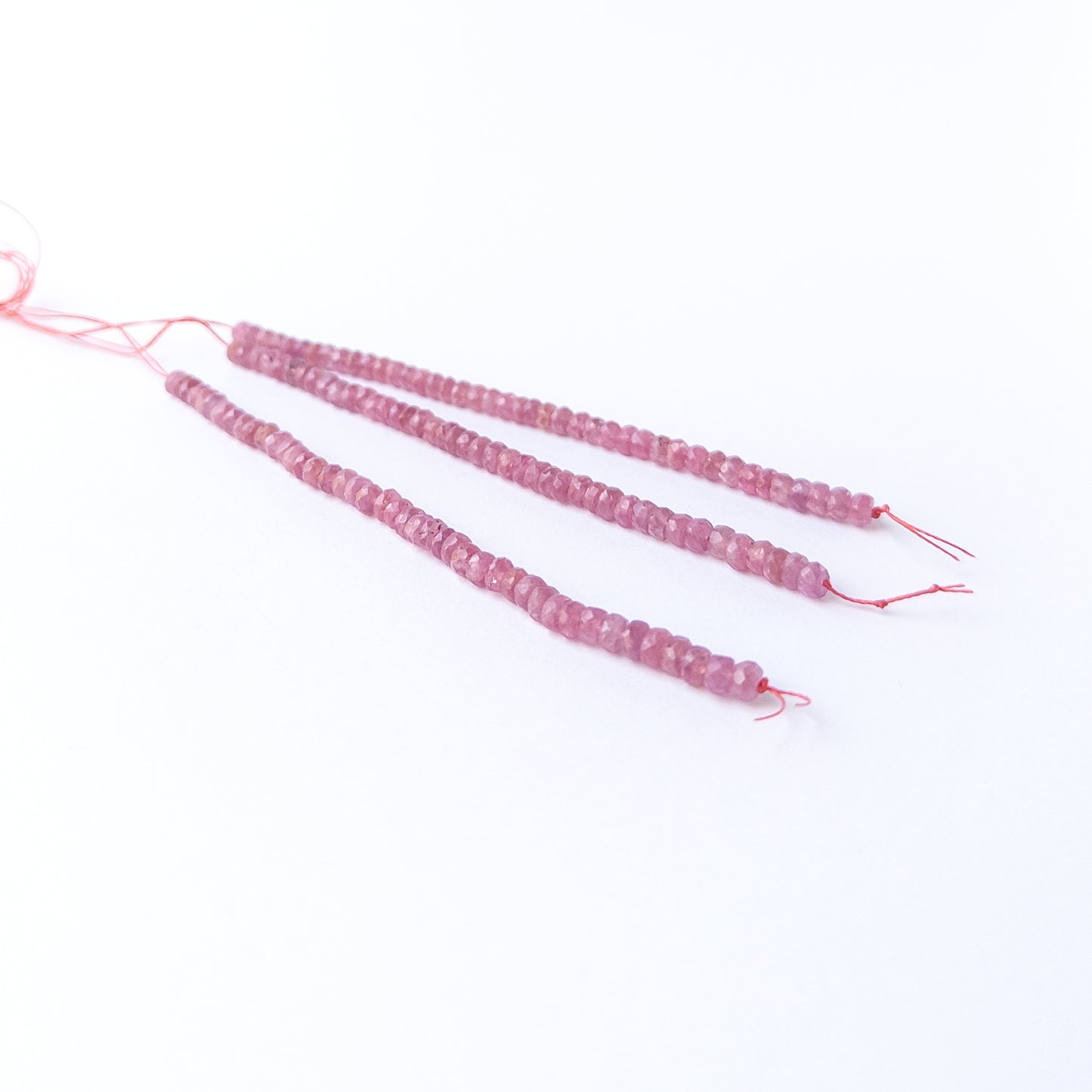 Ruby faceted rondelle beads with natural shine, perfect for DIY jewellery makers using authentic gemstone beads.