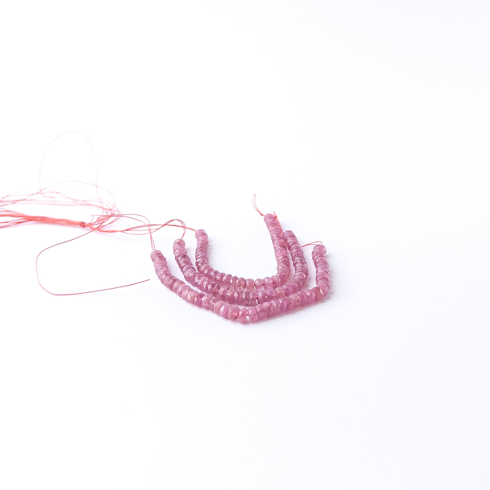 Handmade jewellery components featuring Ruby rondelles with polished facets and deep red brilliance.