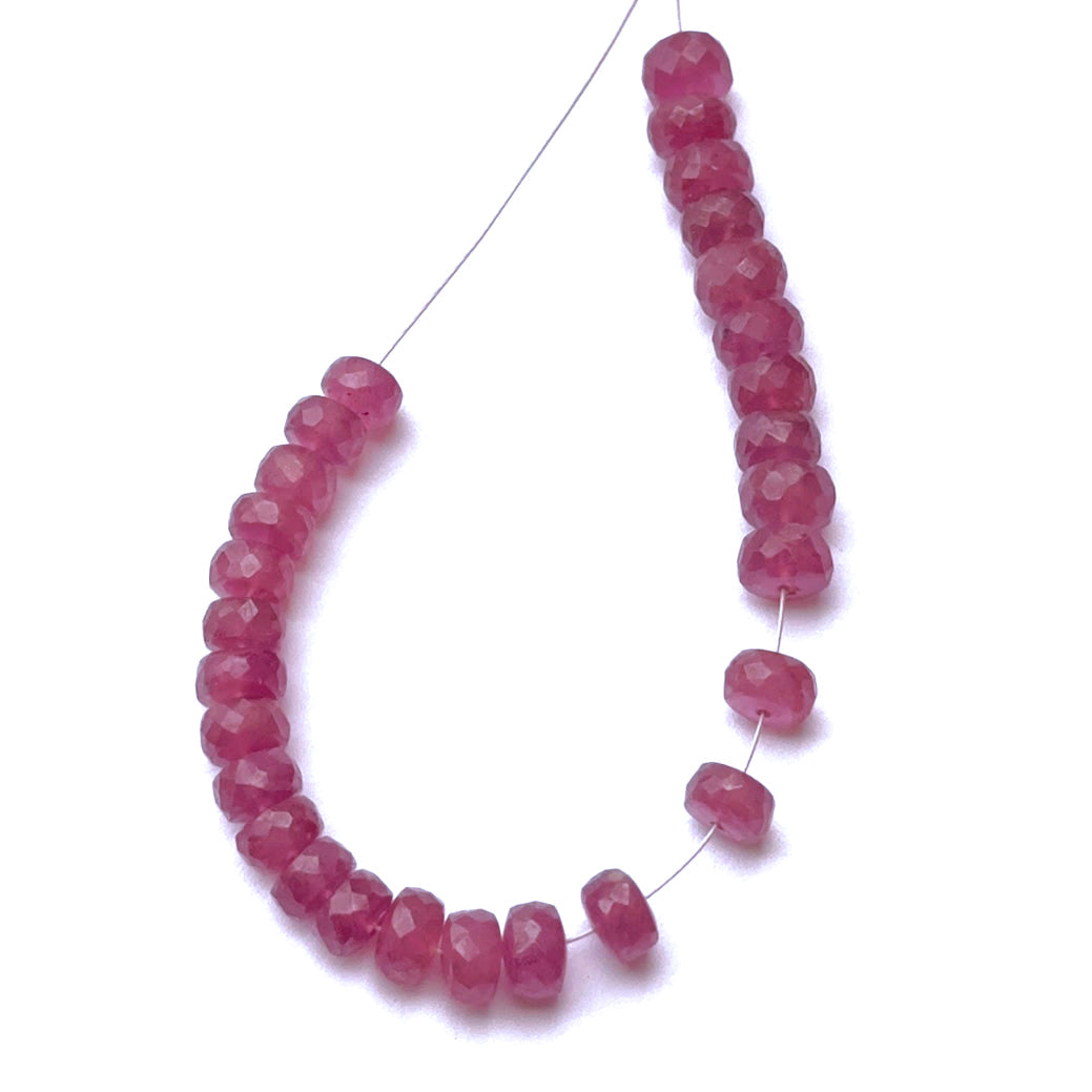 Ruby rondelle beads arranged in a 10cm strand, featuring bright sparkle and premium gemstone beads for jewellery making.
