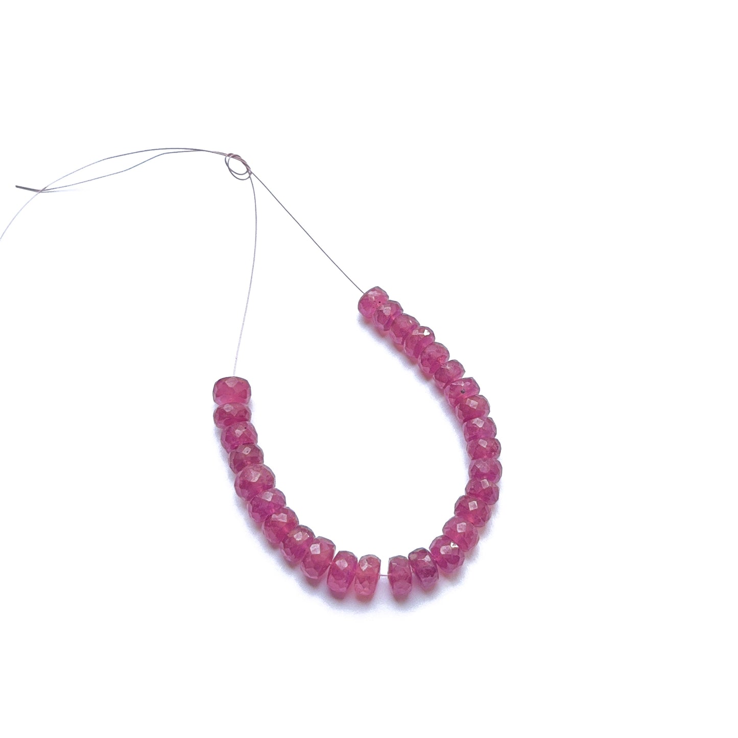 Ruby faceted rondelle beads in deep red tones, showcasing sparkling cuts and gemstone beads for DIY jewellery.