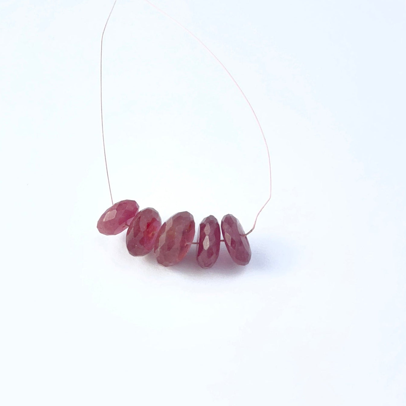 Ruby faceted rondelle gemstone beads showing deep red colour and crisp faceting