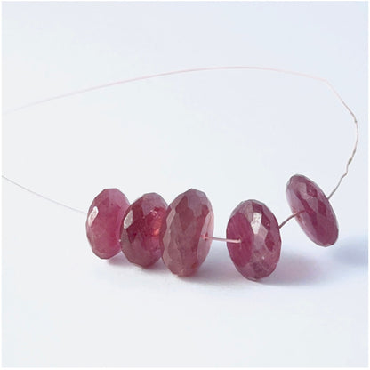 Ruby rondelle beads with genuine red tones and reflective faceting for creative jewellery designs.