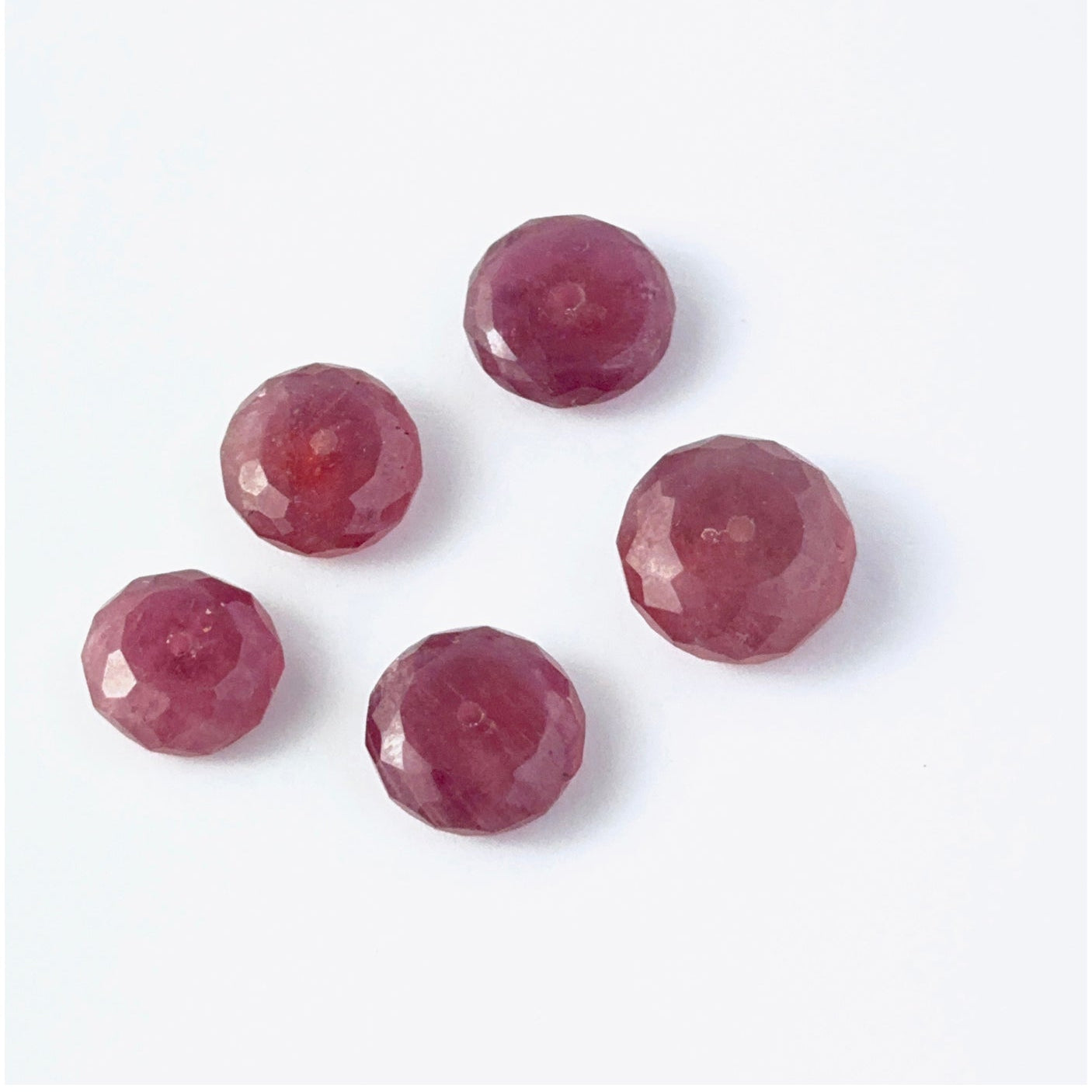 Close view of Ruby faceted rondelle beads showing cut, clarity and premium gemstone quality