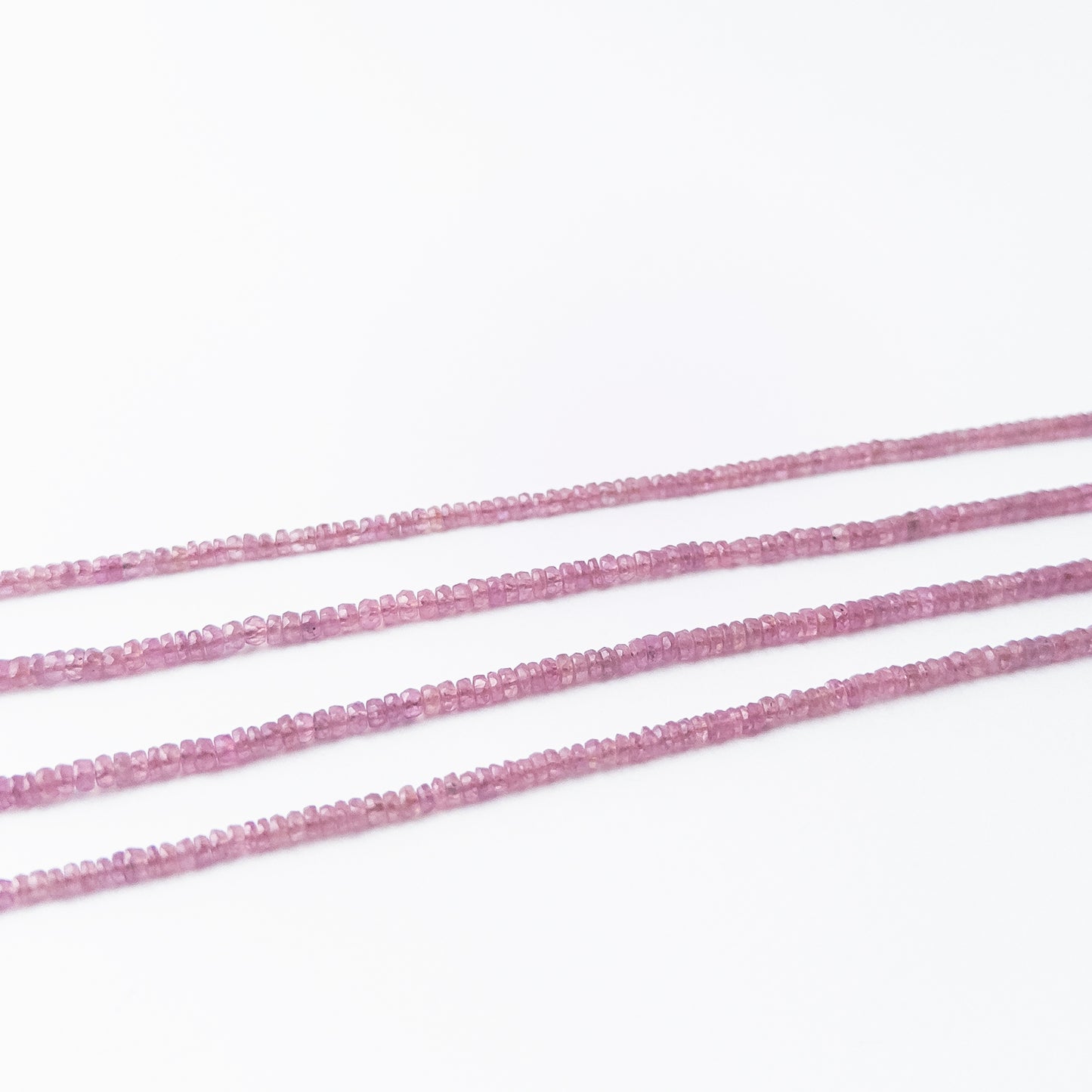 Shimmering Ruby rondelle beads with deep crimson hues, genuine stone beads suited for detailed beadwork and crafting