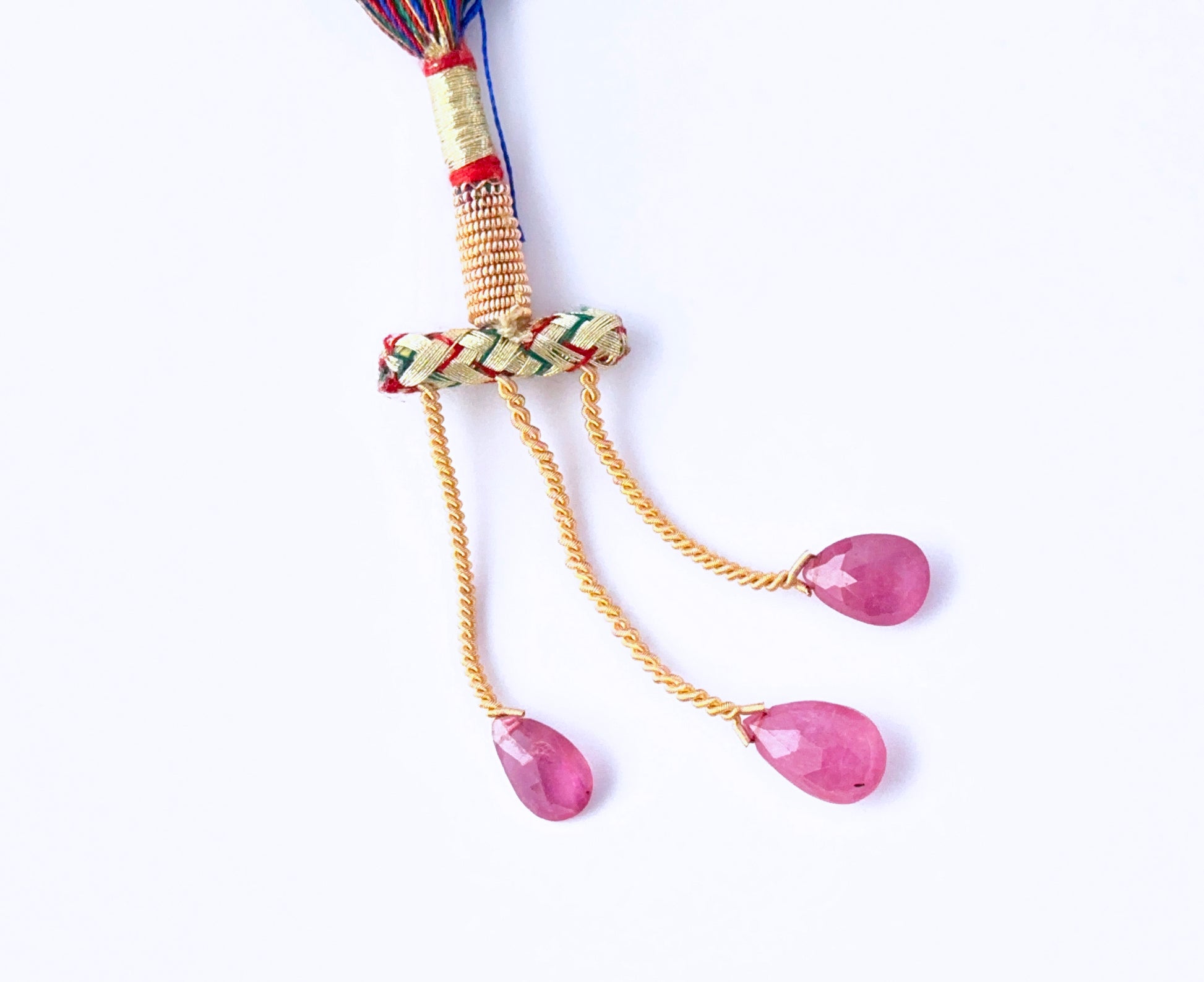 Stone beads made from Ruby teardrops with shimmering faceted surfaces.