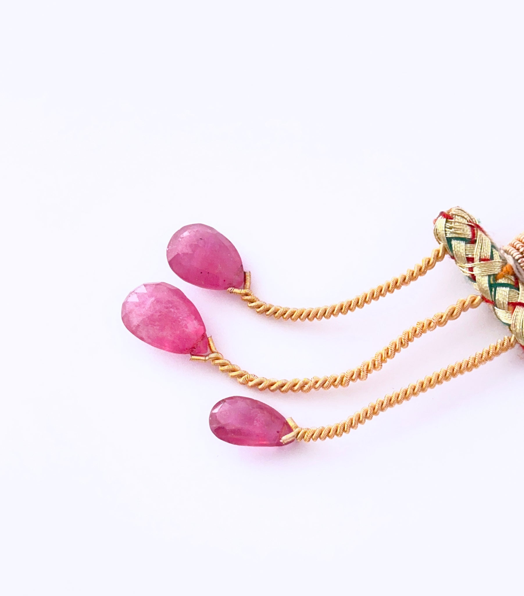 Close‑up of Ruby teardrop stones arranged to highlight brilliance and clarity.