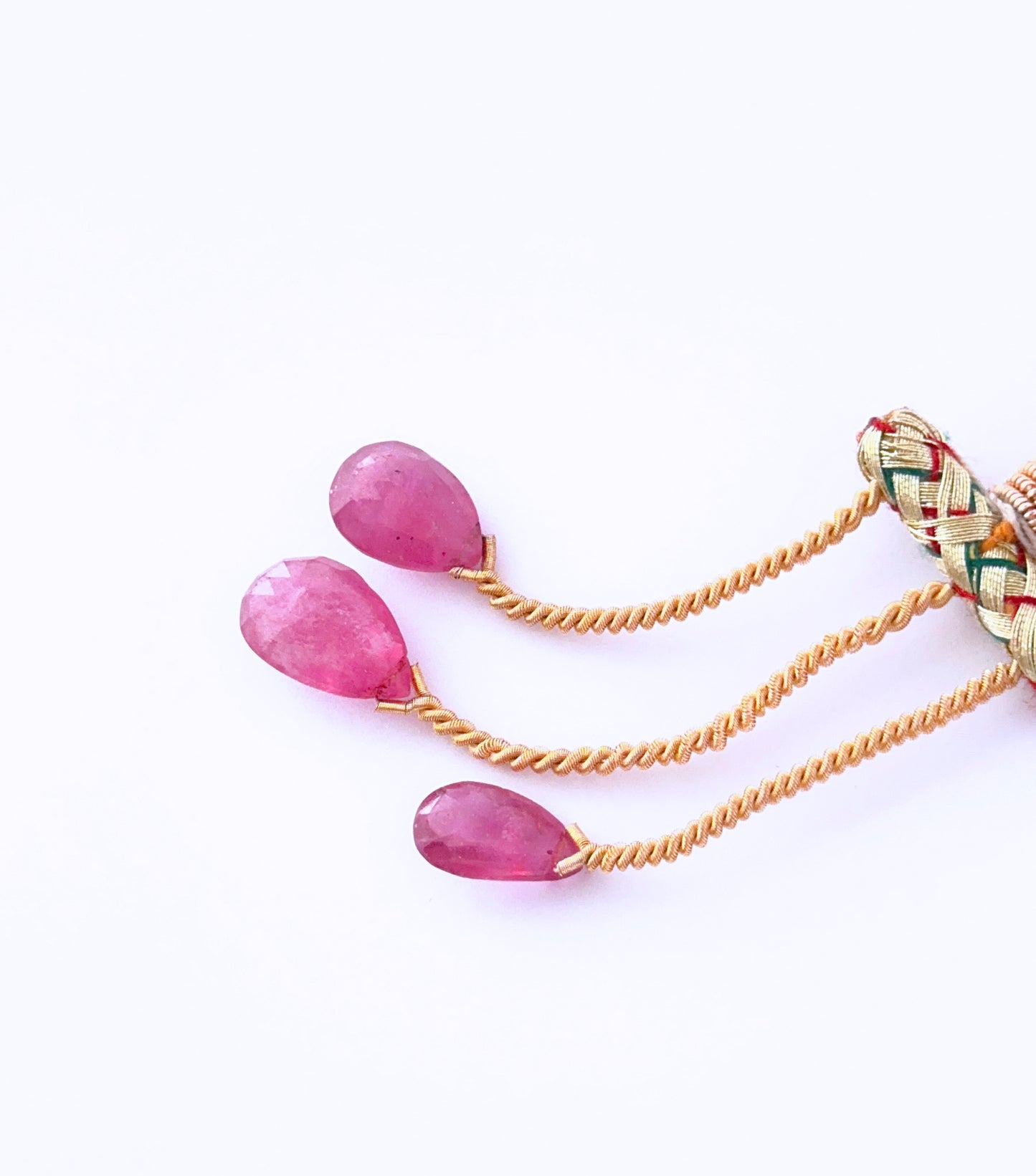 Ruby 13–16mm faceted teardrops with deep red tones and elegant shape.