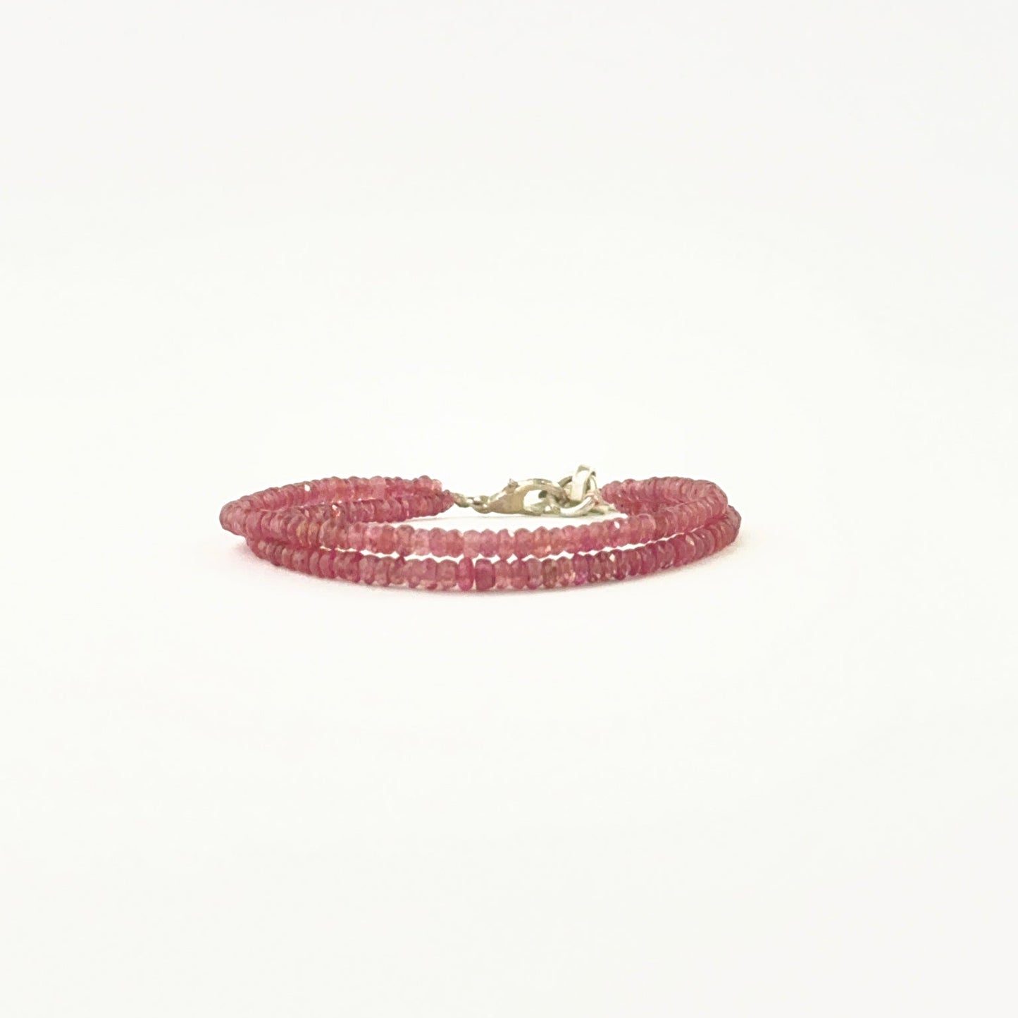 Elegant two‑strand ruby bracelet showcasing faceted 3–3.2mm rondelle beads.