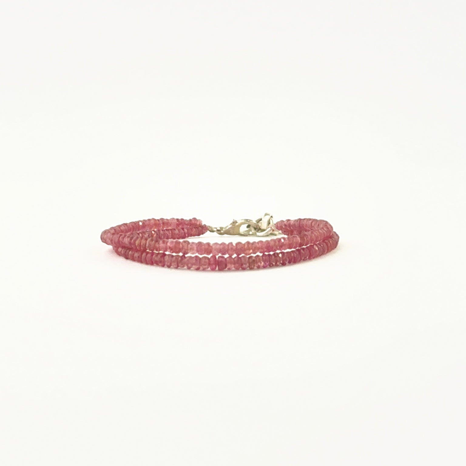 Elegant two‑strand ruby bracelet showcasing faceted 3–3.2mm rondelle beads.
