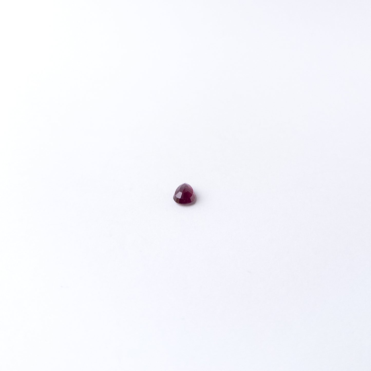 Genuine Ruby gemstone cabochon displaying rich red tone, smooth curves and premium handmade jewellery quality.