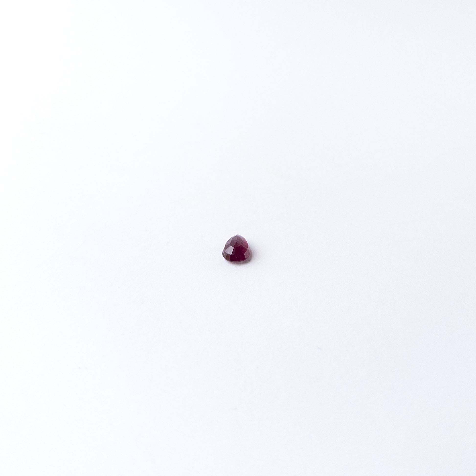 Genuine Ruby gemstone cabochon displaying rich red tone, smooth curves and premium handmade jewellery quality.