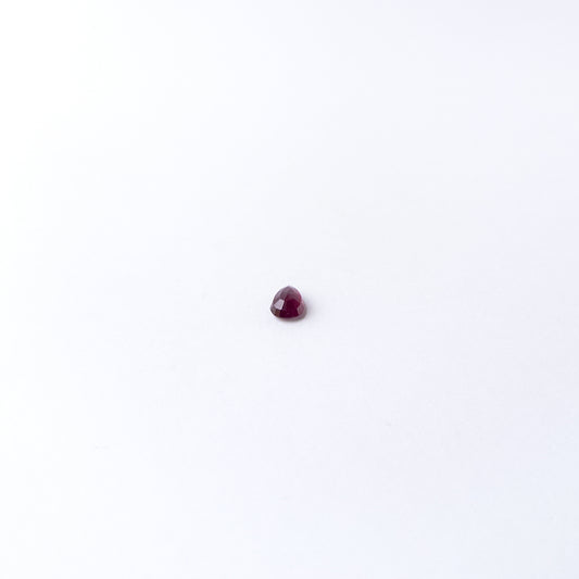 Genuine Ruby gemstone cabochon displaying rich red tone, smooth curves and premium handmade jewellery quality.