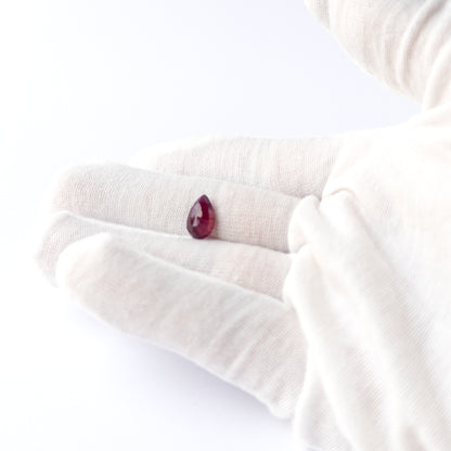 Ruby pear cabochon bead with polished finish and natural colour depth, perfect for DIY jewellery makers.