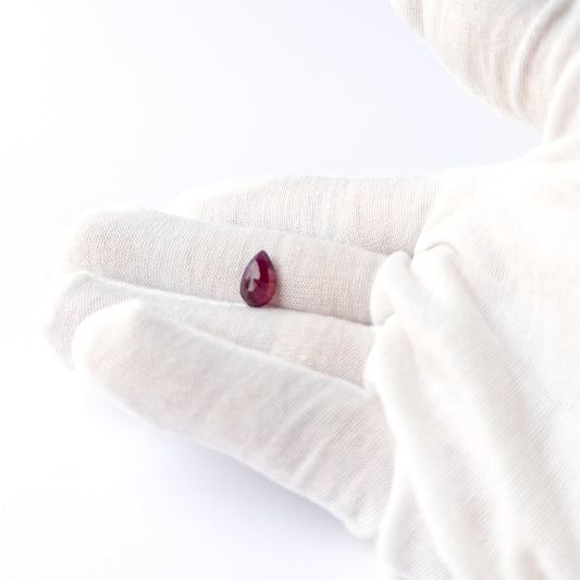 Ruby pear cabochon bead with polished finish and natural colour depth, perfect for DIY jewellery makers.