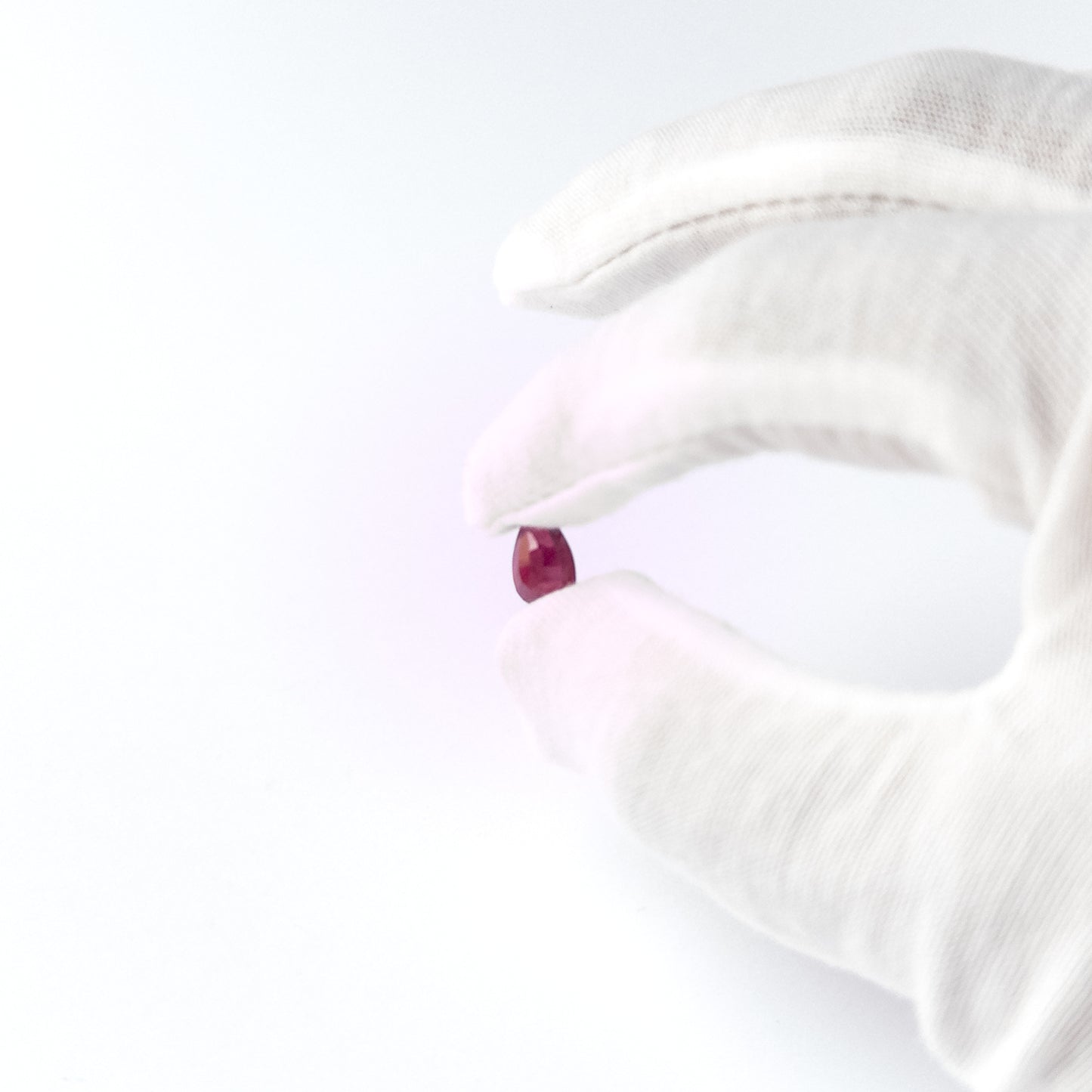 Handmade jewellery components featuring Ruby pear‑cut cabochon with vibrant red hue and refined shaping.