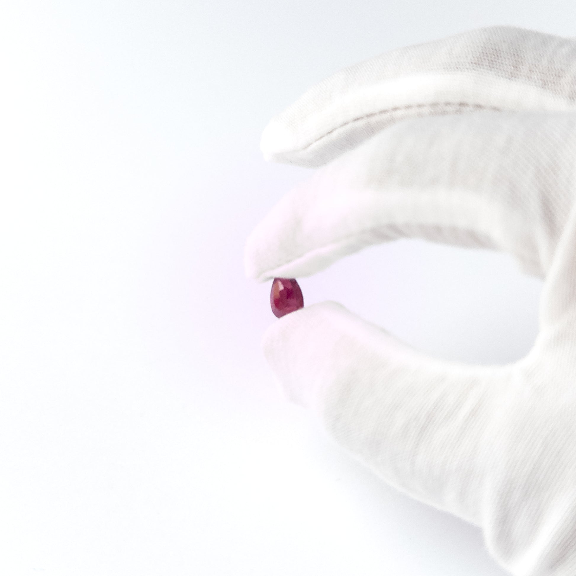Handmade jewellery components featuring Ruby pear‑cut cabochon with vibrant red hue and refined shaping.