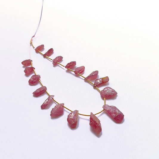 Stone beads in raw ruby showcasing raw texture and rich colour. 
