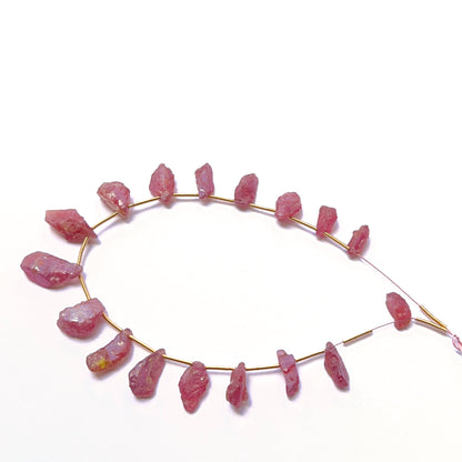 Close-up of gemstone beads highlighting rough cut and organic form. 