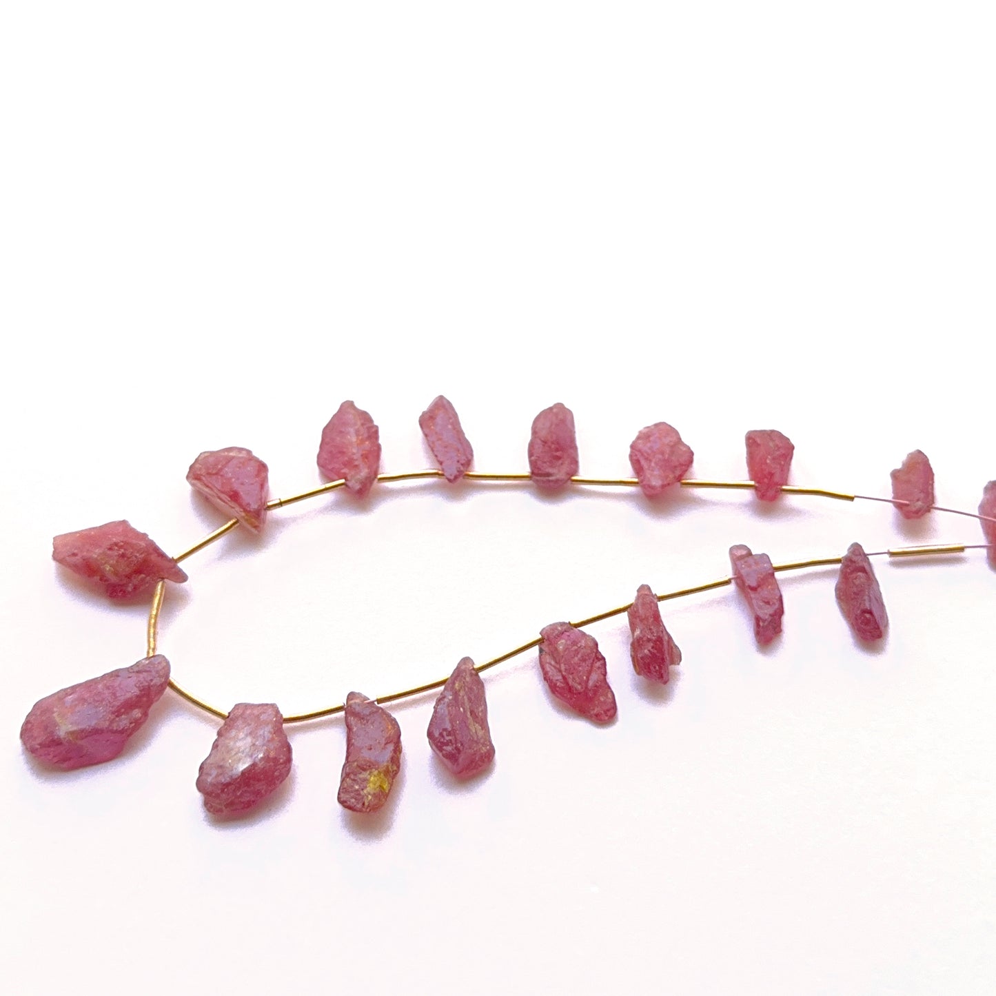 Handmade jewellery components featuring ruby rough pieces with bold character