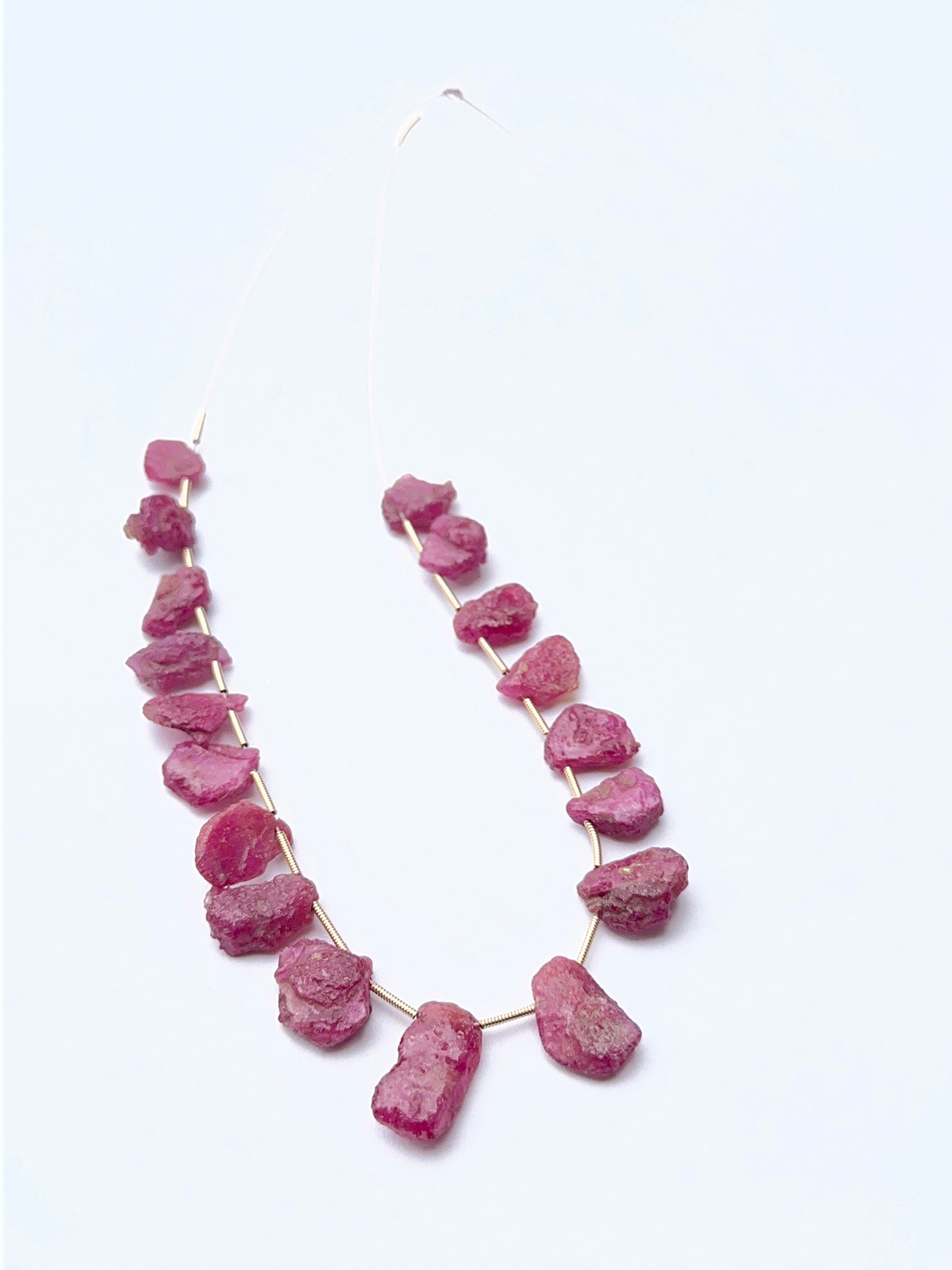 Ruby rough gemstone beads showing deep red tones and raw texture for handmade jewellery designs.