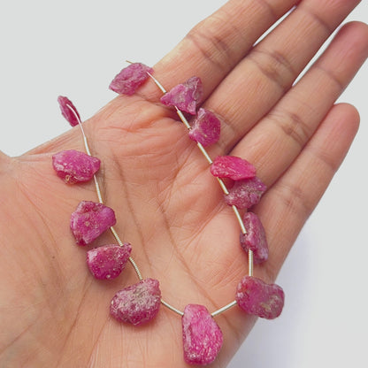 Raw ruby stone beads displayed with visible texture, ideal for gemstone beads in jewellery making.