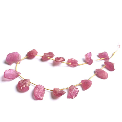 Ruby rough stones arranged neatly to showcase gemstone quality and handcrafted appeal.