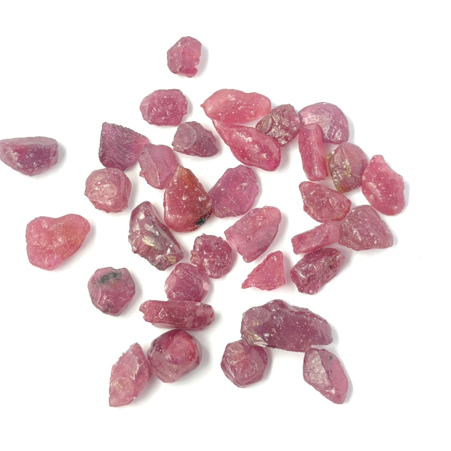 Ruby rough undrilled stones showing deep red tones and natural texture, ideal for genuine gemstone beads in DIY jewellery.