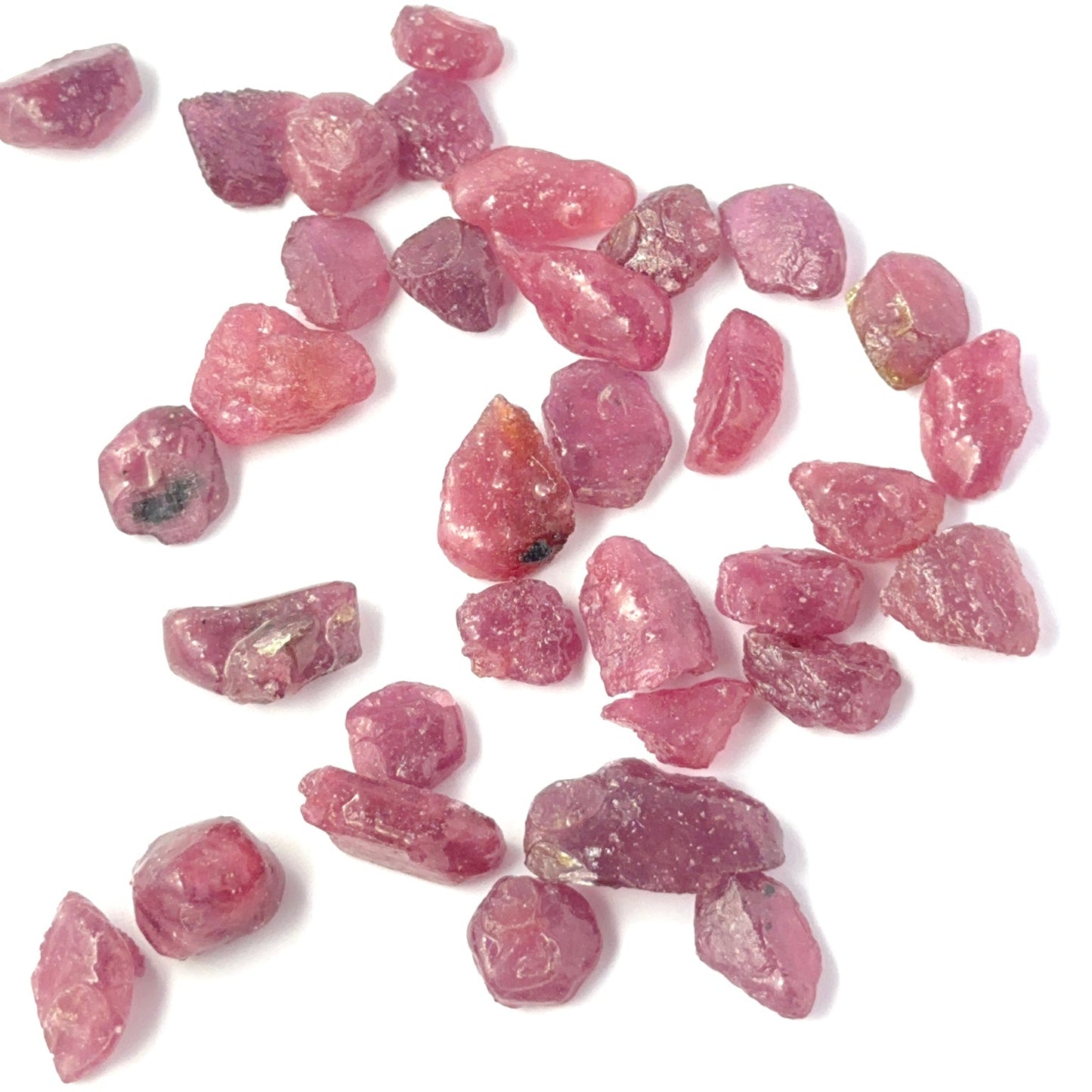 Vibrant Ruby rough stones with organic form and bold colour, perfect for authentic gemstone beads in creative designs.