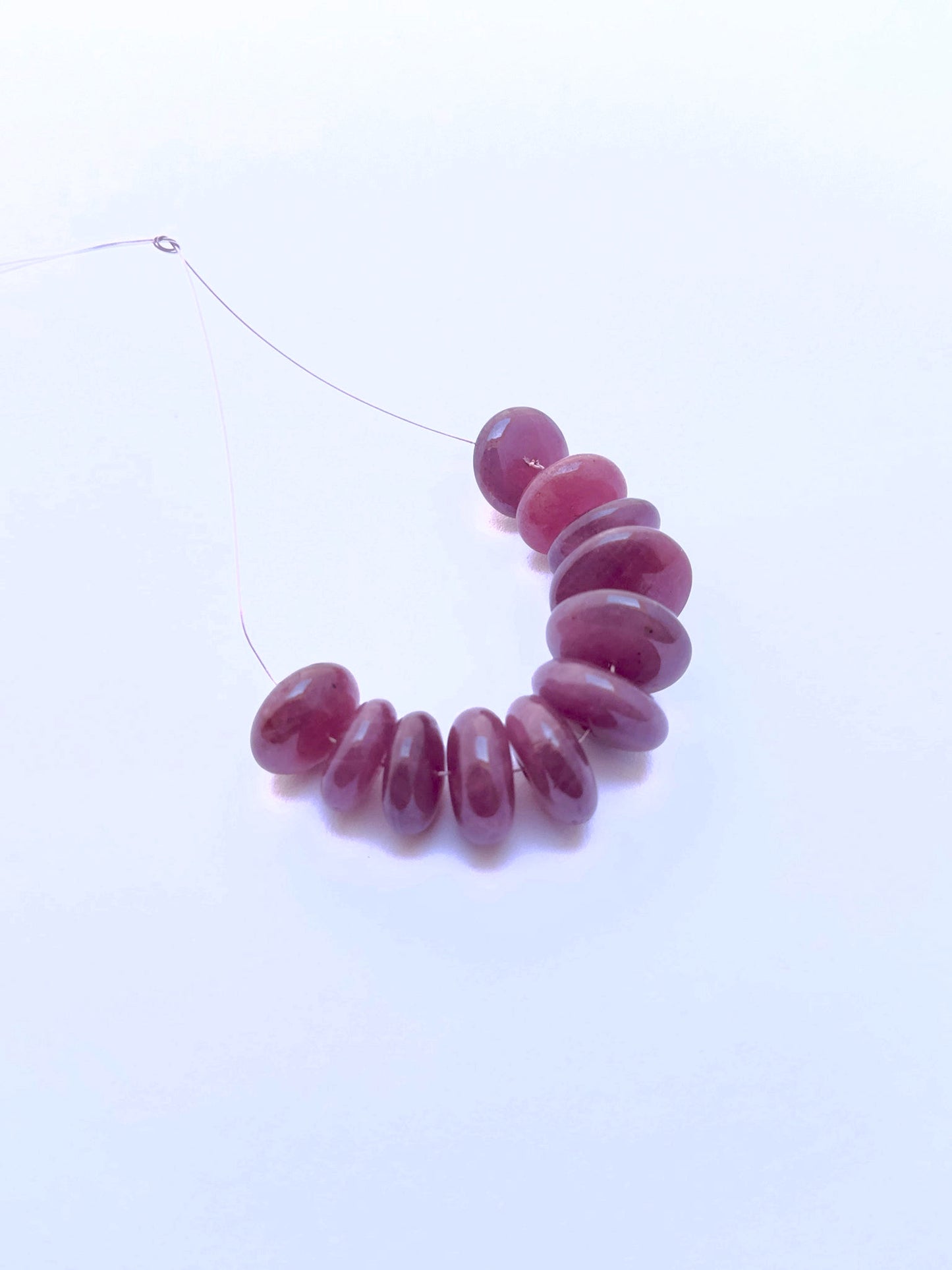 Polished ruby smooth discs with radiant colour and high-quality finish, perfect stone beads for creative jewellery making.