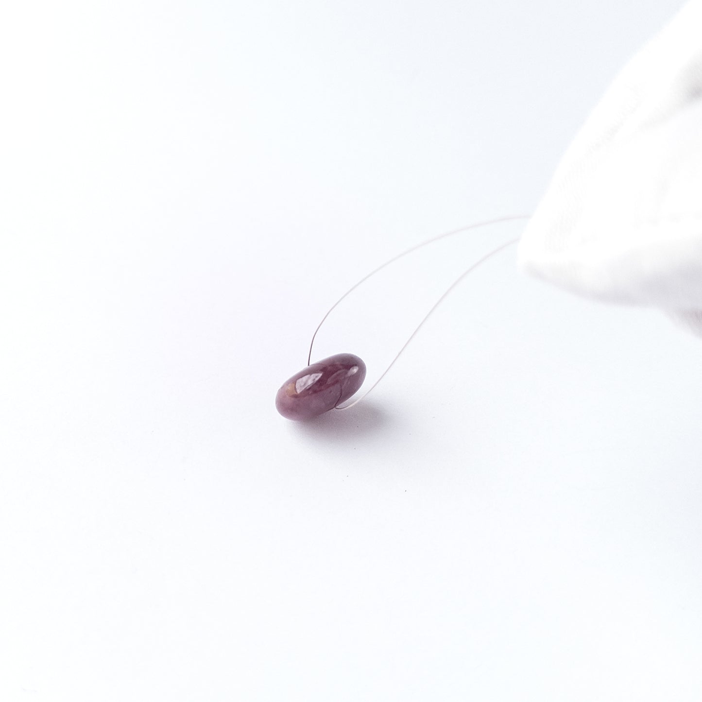 Handmade jewellery components featuring Ruby disc cabochon with polished finish and vibrant red hue.