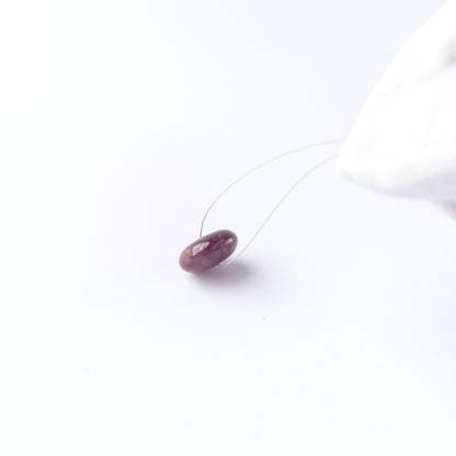 Handmade jewellery components featuring Ruby disc cabochon with polished finish and vibrant red hue.