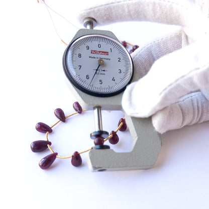 Vibrant red ruby beads in smooth drop cut, perfect for gemstone beads for DIY jewellery and luxury beadwork.