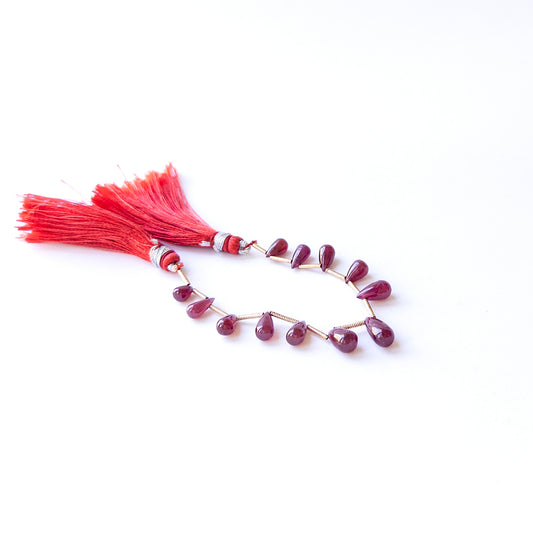 Authentic Ruby stone beads with smooth drop cut, ideal for DIY jewellery makers seeking premium gemstone components.