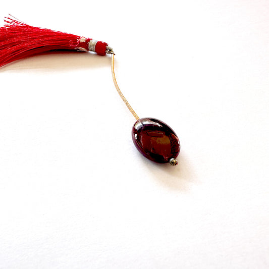 Ruby smooth oval bead with deep red colour and glossy finish, measuring 20mm x 14.5mm.