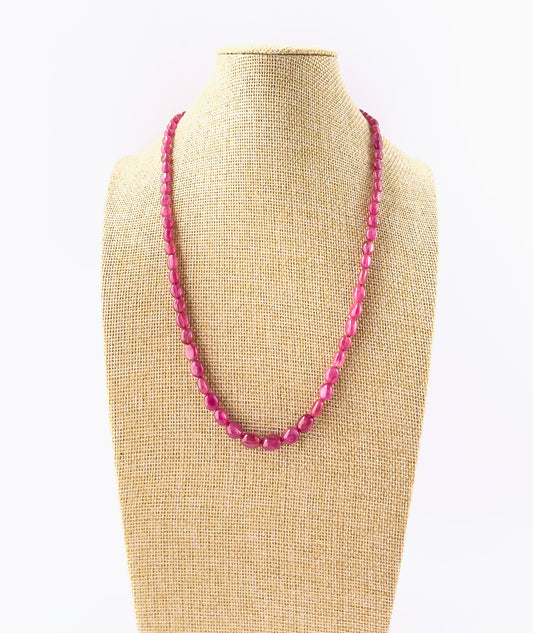 Ruby necklace featuring smooth oval beads sized 6.9–9.5mm × 5.2–8mm, arranged in a 46cm adjustable strand with a rich red polished finish.