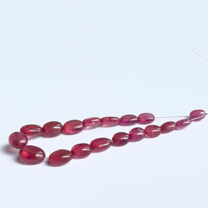 Ruby oval beads with polished surface and mixed sizes, ideal gemstone beads for jewellery.
