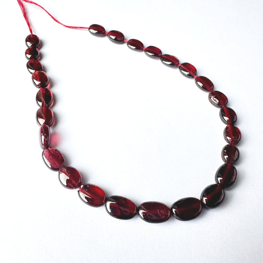 High-quality Ruby ovals with 0.5mm bead holes and vibrant crimson tones.