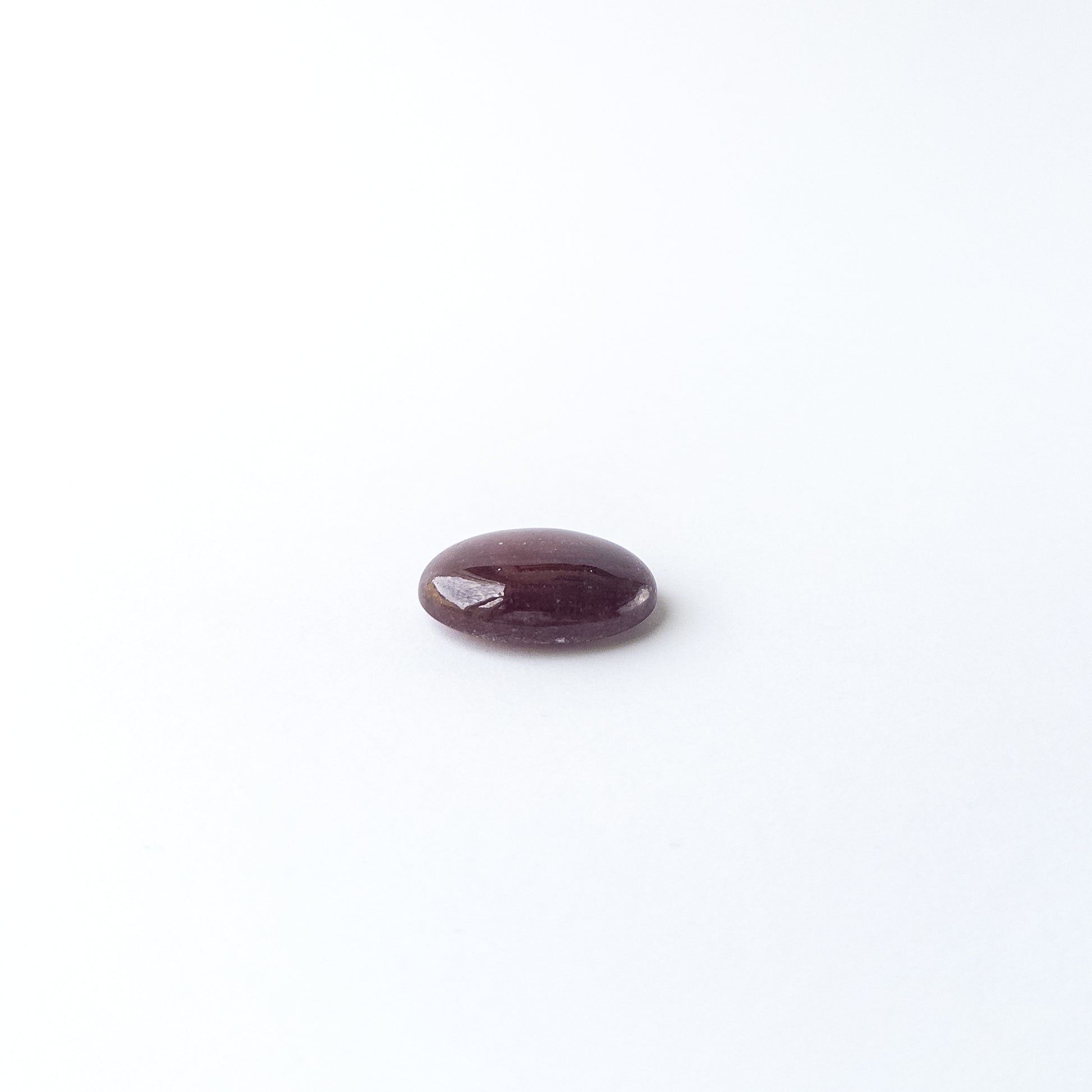 Ruby smooth oval cabochon with natural colour depth and shine, perfect for DIY jewellery creators.