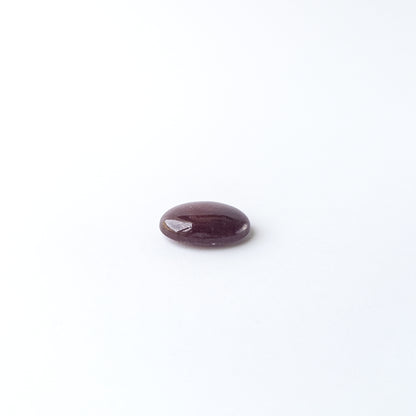 Ruby smooth oval cabochon with natural colour depth and shine, perfect for DIY jewellery creators.