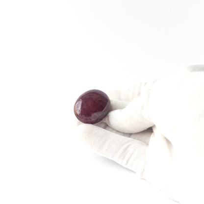 Genuine Ruby stone cabochon displaying rich red tone, glossy surface and premium handmade jewellery quality.