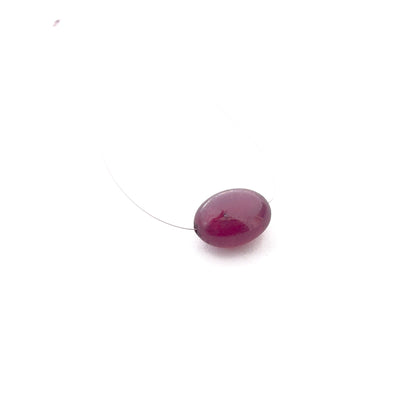 Ruby smooth oval top‑drilled gemstone bead showing rich red colour and polished shine for handmade jewellery.