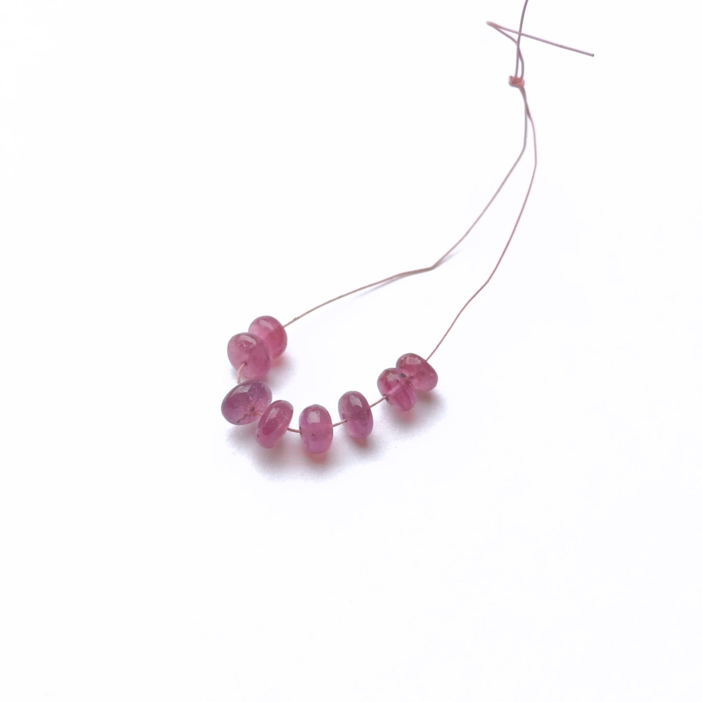 Ruby smooth rondelle beads in deep red tones for gemstone bead designs.