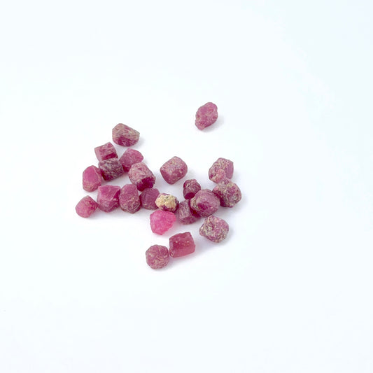 Ruby rough stones showing deep red tones and raw uncut texture.