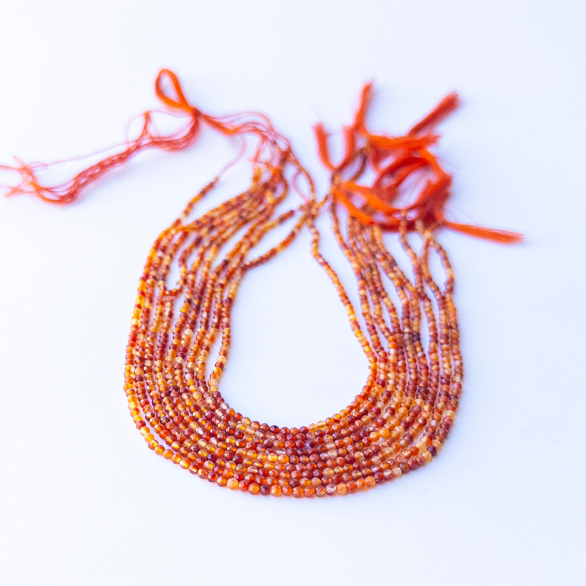 Premium Rutile stone beads arranged in strands, showcasing natural rutile threads and high‑quality faceting for jewellery design.
