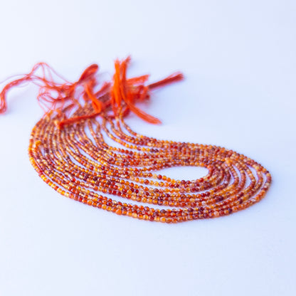 Genuine Rutile gemstone beads in faceted rondelle shape, displaying clarity, sparkle, and natural inclusions for jewellery crafting.