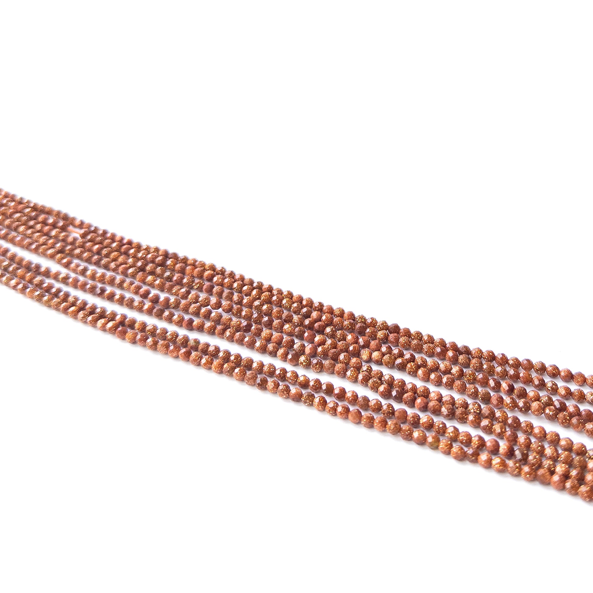 Handmade jewellery components featuring natural Sandstone faceted rondelles, highlighting their shimmer, colour, and refined finish.