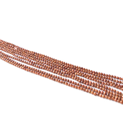 Handmade jewellery components featuring natural Sandstone faceted rondelles, highlighting their shimmer, colour, and refined finish.