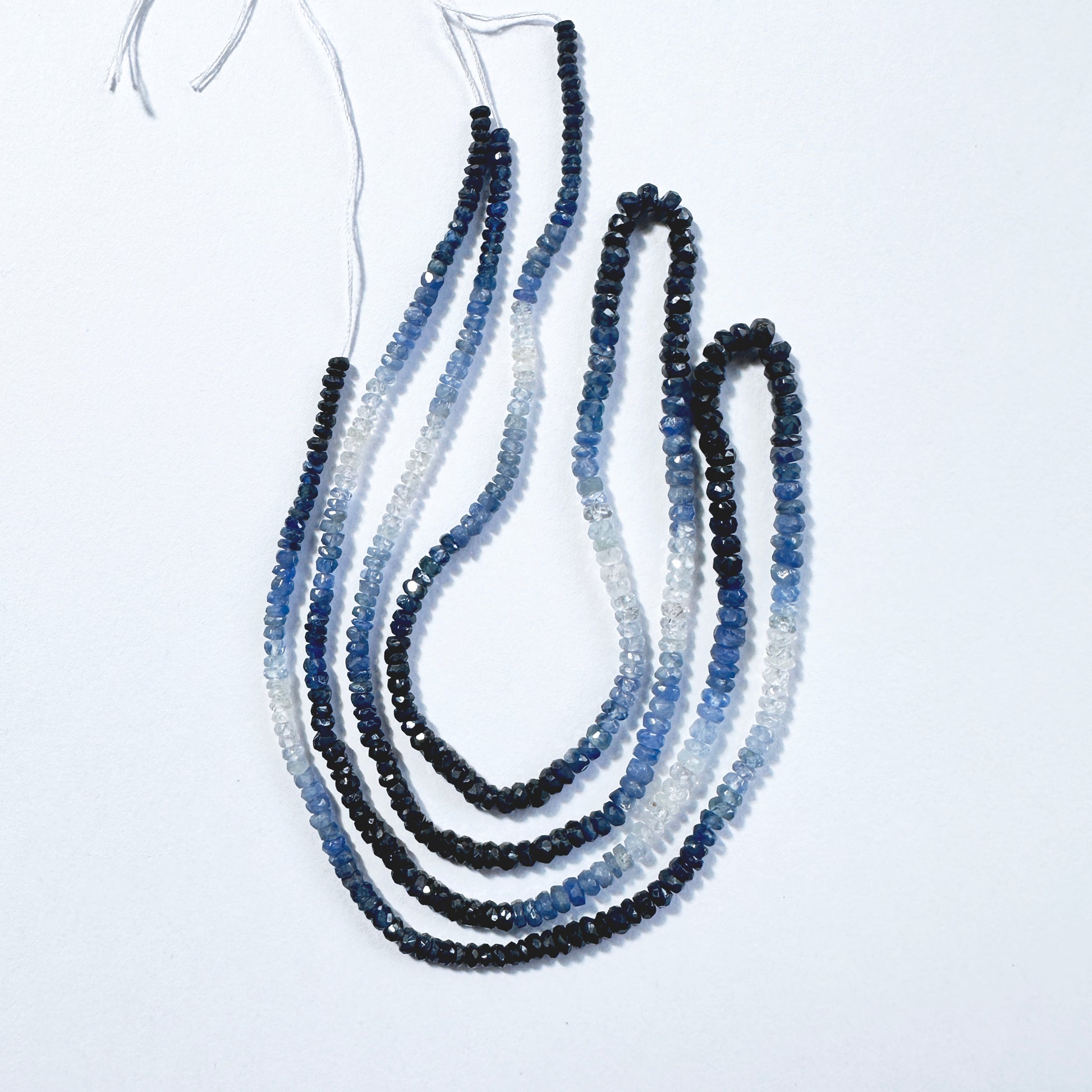 Premium shaded sapphire beads in rondelle cut,  aligned in a luminous 40cm arrangement.